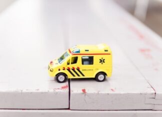 Here’s Why Investing in a Health Insurance Plan Is a Smart Choice This Festive Season yellow car toy on white surface