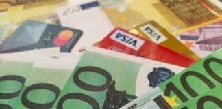 a pile of different types of euro bills