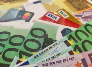 a pile of different types of euro bills