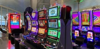 empty chairs in front of arcade machines