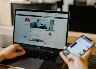 Trends in Mobile Advertising: Navigating the Ever-Evolving Landscape person using both laptop and smartphone