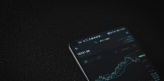black android smartphone on black textile