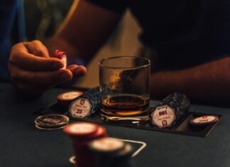 person holding clear drinking glass