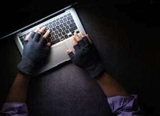 Ensuring Security and Compliance with Secure Shell Key Managers: A Close Look person in black long sleeve shirt using macbook pro
