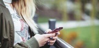 woman holding red phone