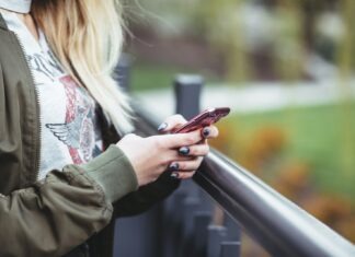 woman holding red phone