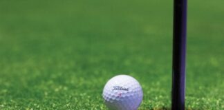 white golf ball on green grass field during daytime