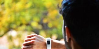 man looking at activity tracker