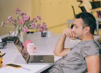 Enhance Efficiency and Excellence in Backend Development Services with an Outstaffing Company man in gray crew neck t-shirt using macbook pro