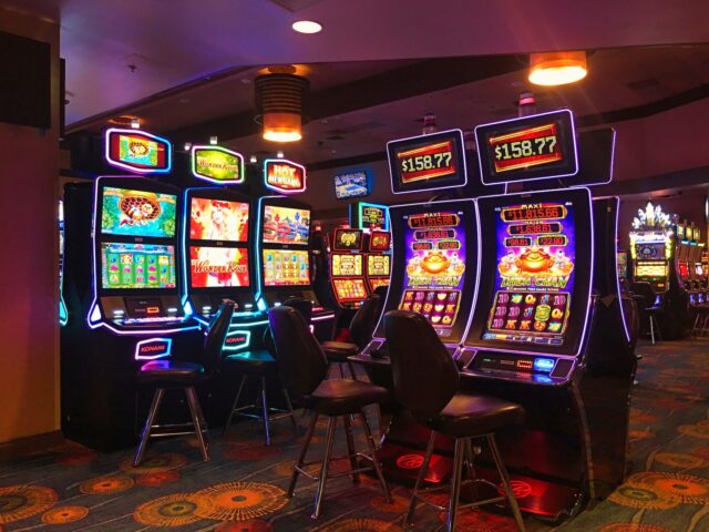 Photo by Christopher Ryan black and blue arcade game machine