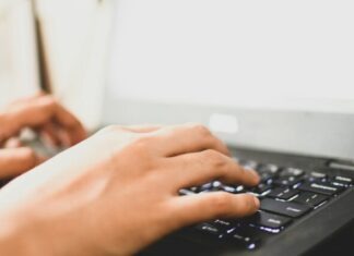 person using black computer keyboard