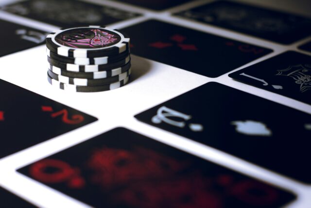 Photo by Esteban López poker chip on white surface