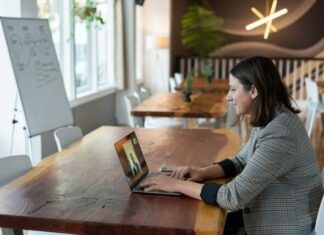 The Challenges and Benefits of Online Learning woman in gray and white striped long sleeve shirt using silver macbook