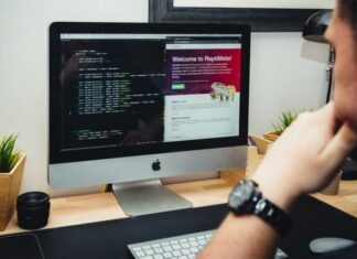 How to Hire a Magento Developer silver imac on brown wooden desk