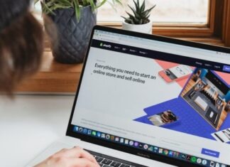 What Does a Shopify Theme Developer Do? person using macbook pro on white table