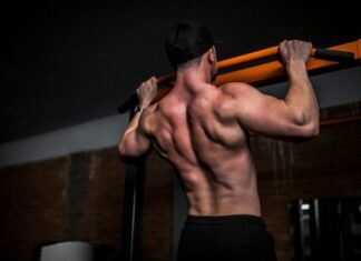 Muscle Mass: Food and Ways How to Increase topless man in black shorts holding orange bar