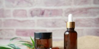 brown glass bottle on brown textile