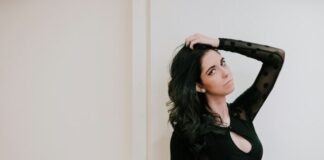 woman wearing black long-sleeved dress