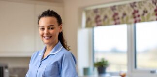 A person in a blue uniform Description automatically generated