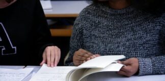 woman flipping book page