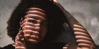 shadow of window on woman's face