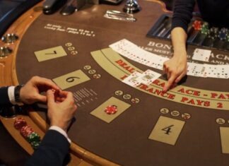 person in black shirt sitting at table