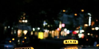 shallow focus photography of Taxi signage