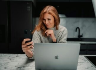From Swipe to Spark: The Complete Online Dating Experience a woman sitting in front of a laptop computer