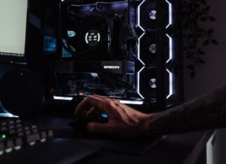 person using computer on table