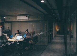Benefits and Challenges of Using Free LMS Software for Training group of people having a meeting