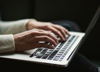 Unleashing the Potential: Low Code Platform for Grants Management person using laptop