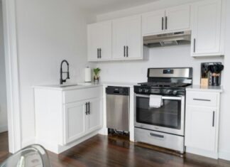 The Impact of Wear and Tear and Age on the Efficiency of Household Appliances white wooden kitchen cabinet and white microwave oven