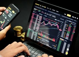 Disrupting Oil Trading with Digital Currencies: The Blockchain Barrel person using black tablet computer