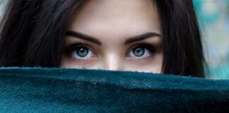 a close up of a person with blue eyes