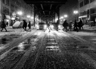 Understanding and Preventing Pedestrian Accidents at Night in Louisville grayscale photo of people walking on street