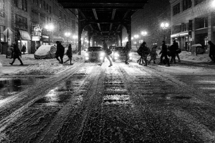 Photo by Kent Henderson grayscale photo of people walking on street