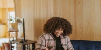 person sitting on couch holding a Surface device