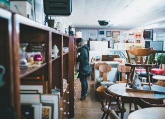 Thriving in the Thrift Store Industry woman standing beside shelf
