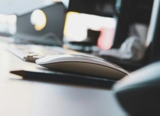 Keeping Your Phone Safe: The Importance of Antivirus Protection black and yellow computer mouse on white desk