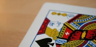 a close up of a playing card on a table