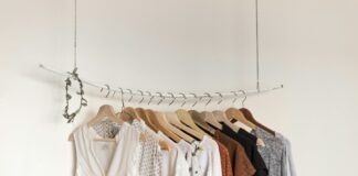 assorted clothes in wooden hangers
