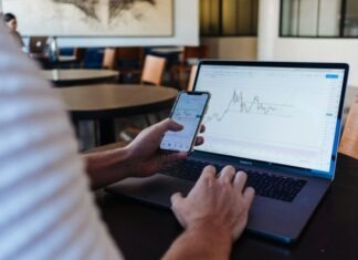 Factor Investing with ETFs: A Quantitative Approach person using smartphone and MacBook Pro