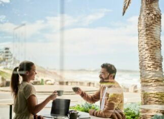 The Role of Personality Tests in Finding Your Perfect Match man in brown jacket sitting beside with woman at coffee shop