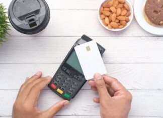 3 Types of Payment Gateways Explained by Interpillar: Which One Will Suit Your Business? a person holding a credit card next to a calculator