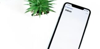 black iphone 5 on white surface