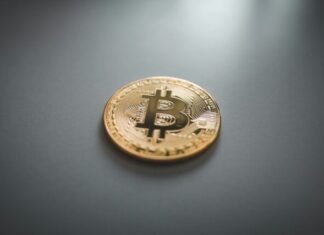 Bitcoin Breakthrough: Unveiling the Future of Financial Investment gold round coin on gray surface