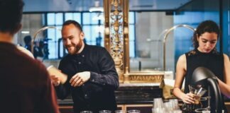 photo of man and woman mixing beverages