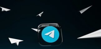 a blue button with a white arrow on it