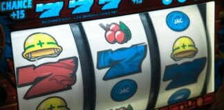 slot machine displaying three seven