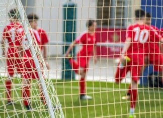 Betting on Sports: Key Strategies for Different Types of Sports Bets soccer players in red jersey shirt playing soccer during daytime